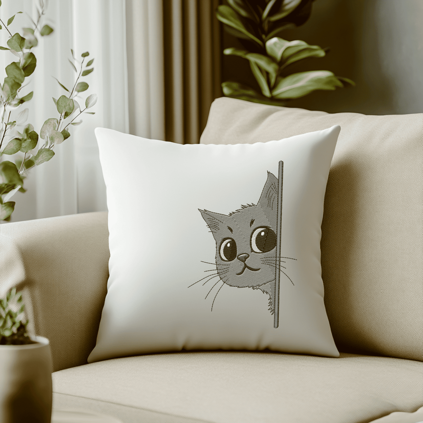 Machine embroidery of a peeking kitten