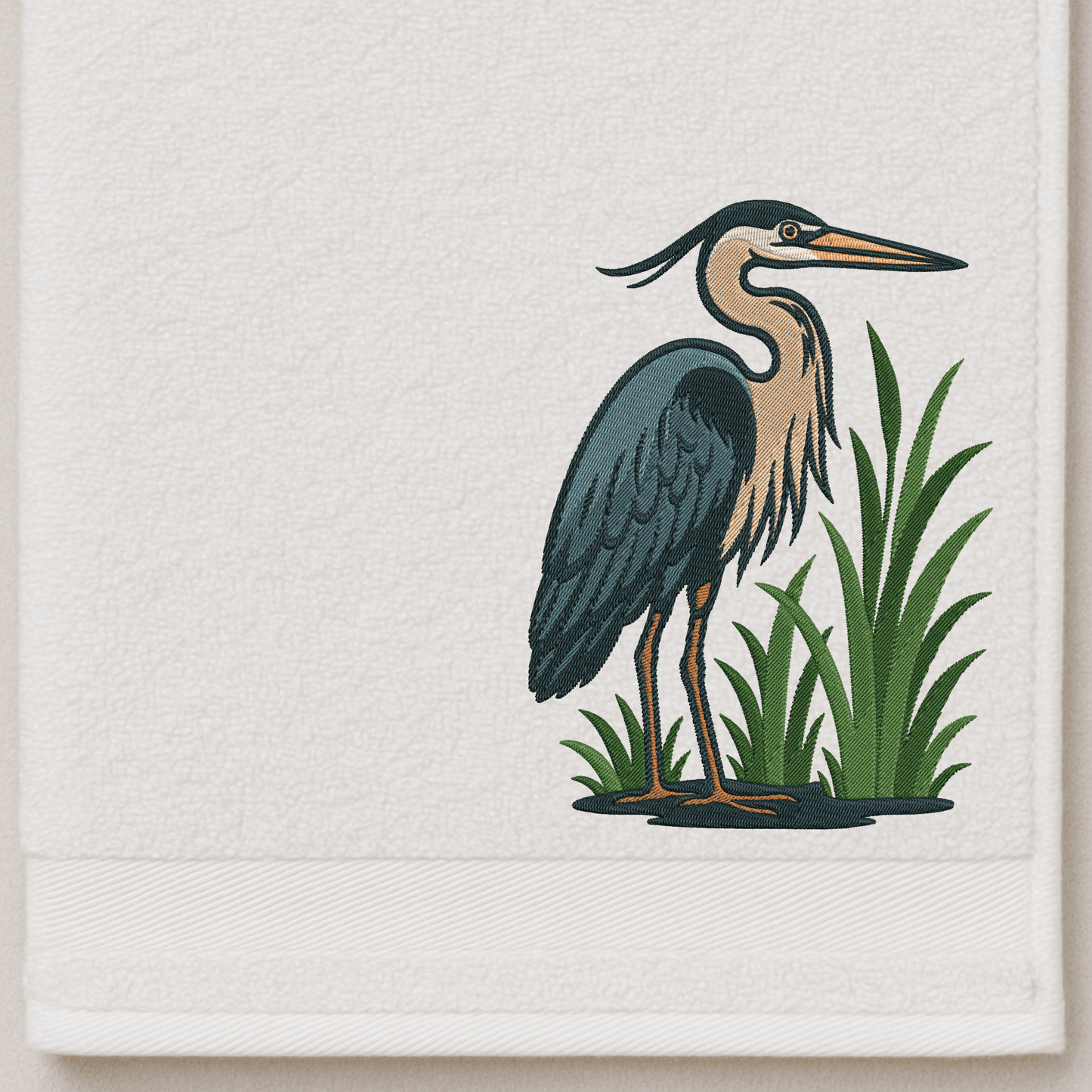 Embroidery of a heron in nature setting