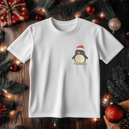 Cute holiday penguin embroidery design stitched in black, cream, gold, red and pink thread.