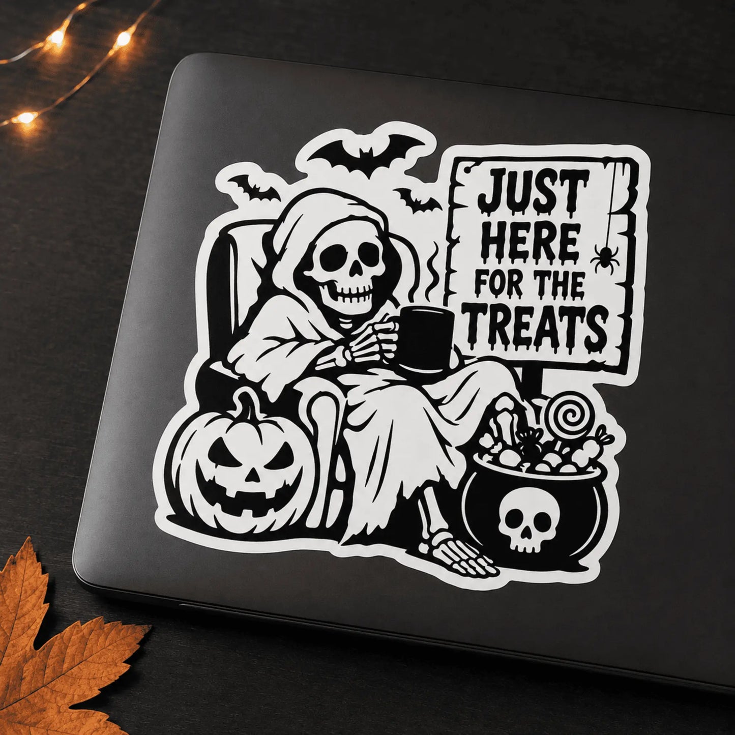 Funny skeleton Halloween vinyl sticker displayed on a black laptop