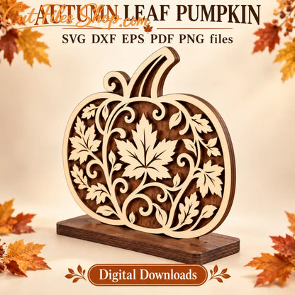 Autumn leaf pumpkin SVG and DXF laser cutting files shown as a freestanding plywood decoration with a slotted base.
