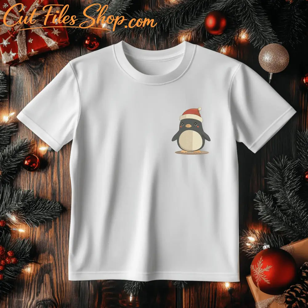 Cute holiday penguin embroidery design stitched in black, cream, gold, red and pink thread.