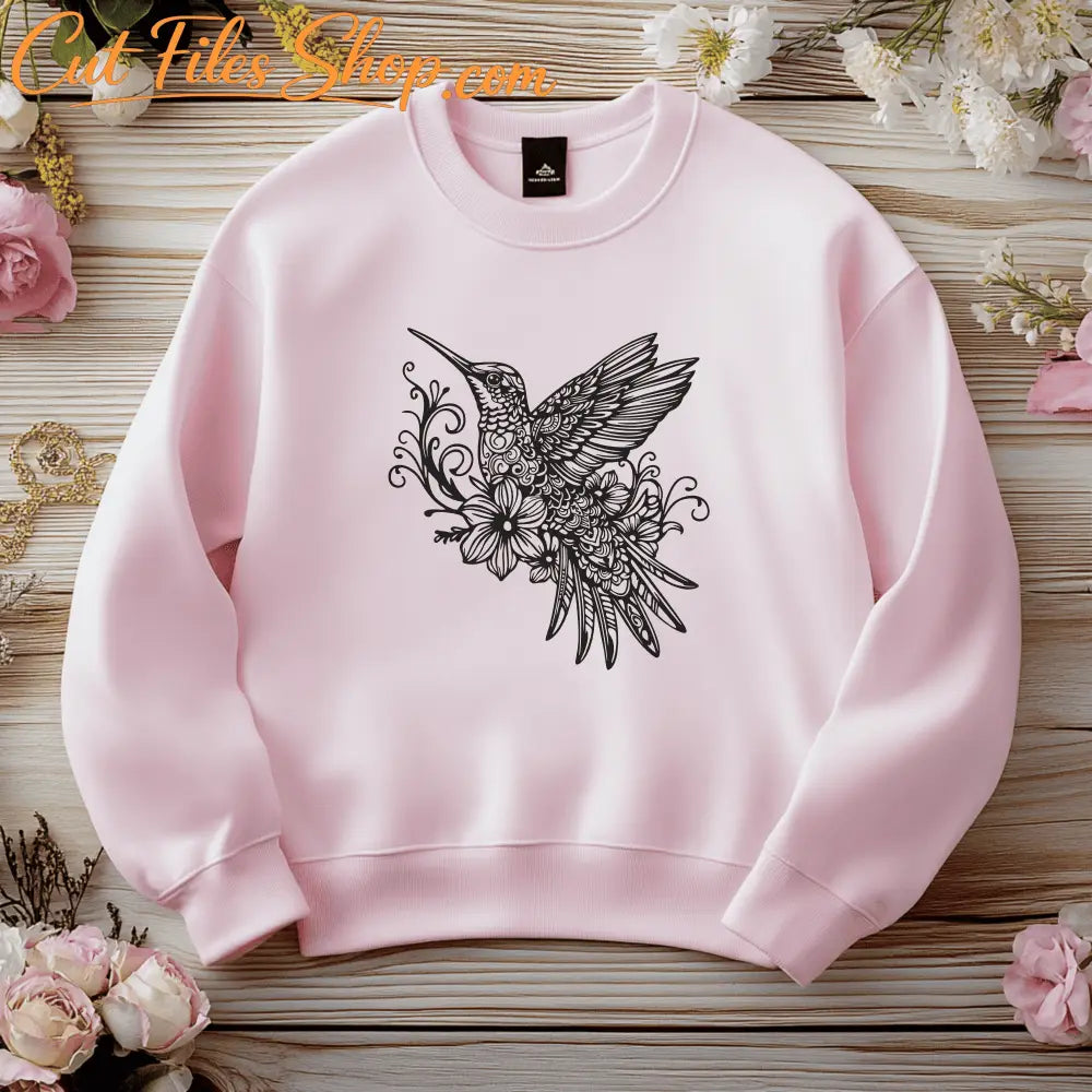 Flying hummingbird with flower detail