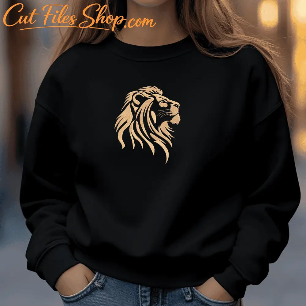 Golden lion head embroidery design with layered mane details on a black textile background.