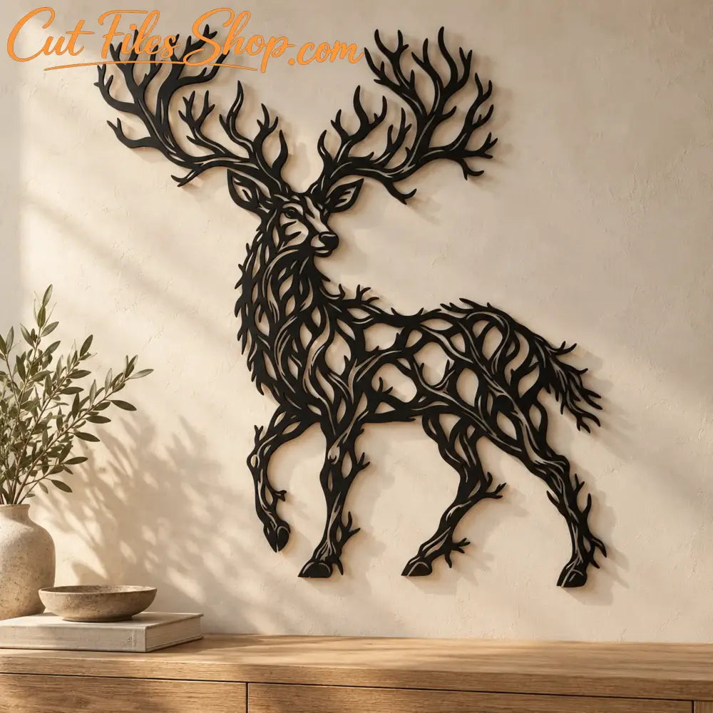 Black metal stag wall art with branching antlers on a warm textured wall above an oak cabinet, styled with a ceramic vase and books.