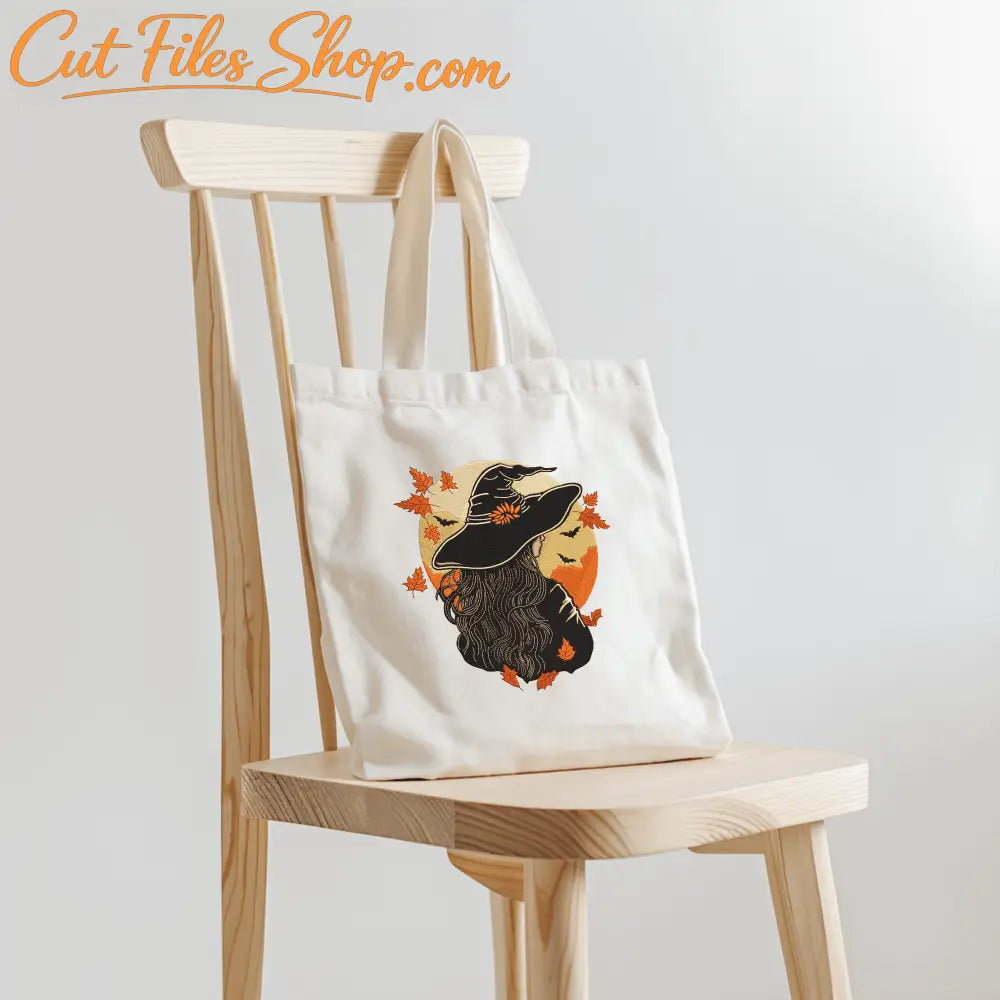 Halloween embroidery applique showing witch woman against moon background